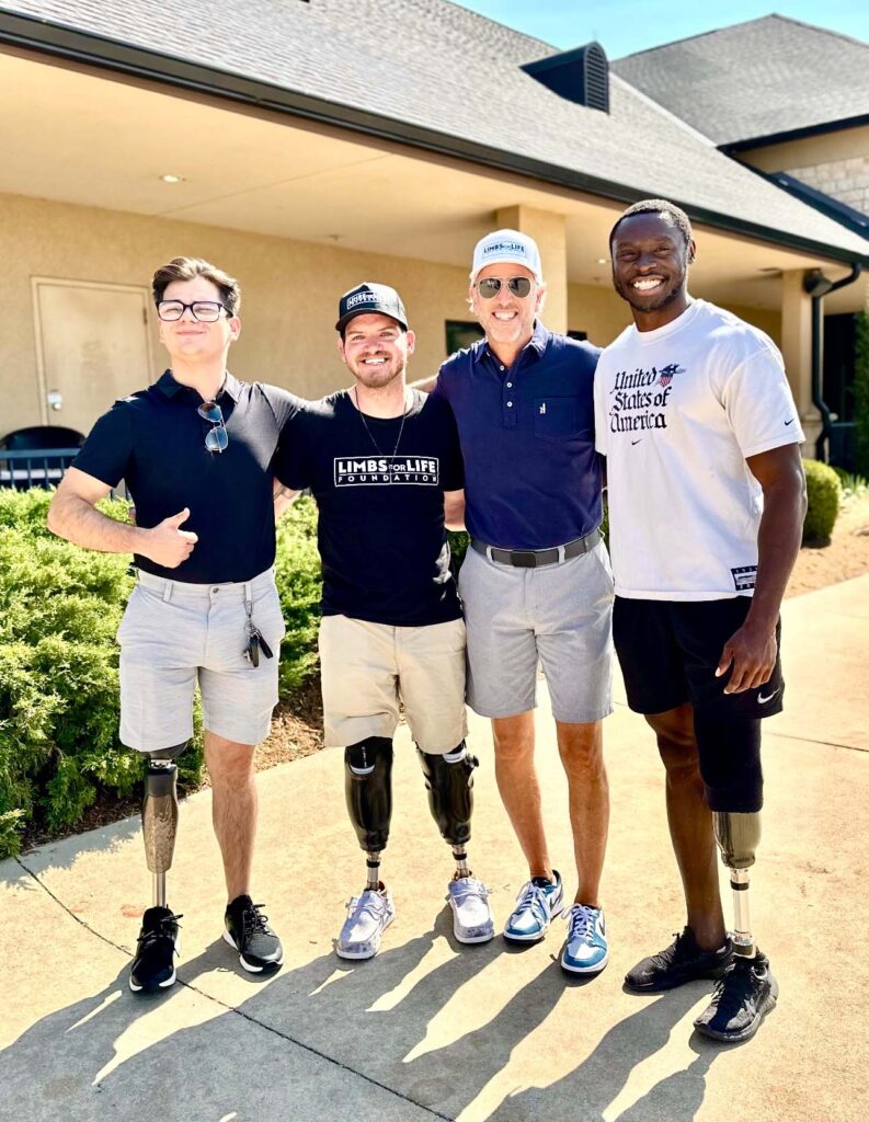 golf tournament participants posing for a group photo